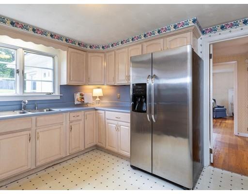 67 Newton Road Springfield, MA 01118 - Photo 15 of 41 a kitchen with a refrigerator and a sink