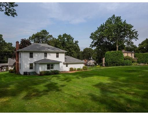 67 Newton Road Springfield, MA 01118 - Photo 3 of 41 a view of a house with a big yard potted plants and large tree
