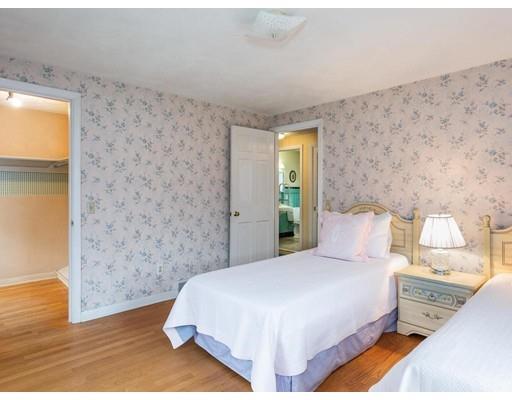 67 Newton Road Springfield, MA 01118 - Photo 33 of 41 a bedroom with a bed and a wall painting
