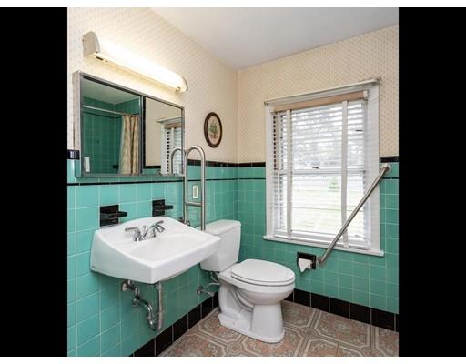67 Newton Road Springfield, MA 01118 - Photo 34 of 41 a bathroom with a toilet sink and mirror