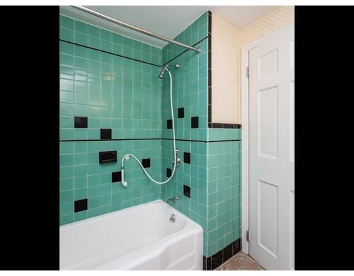 67 Newton Road Springfield, MA 01118 - Photo 35 of 41 a bathroom with a bathtub and a shower