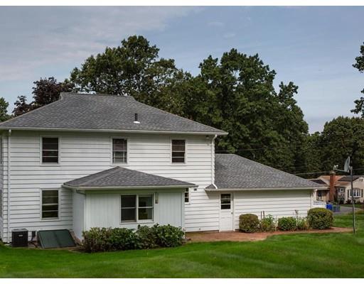 67 Newton Road Springfield, MA 01118 - Photo 4 of 41 a front view of a house with a garden