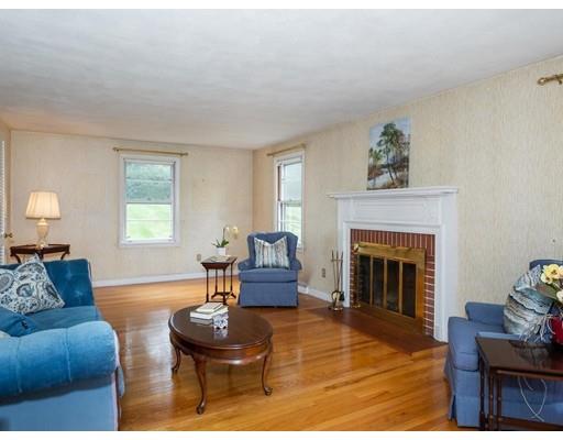67 Newton Road Springfield, MA 01118 - Photo 8 of 41 a living room with furniture and a fireplace