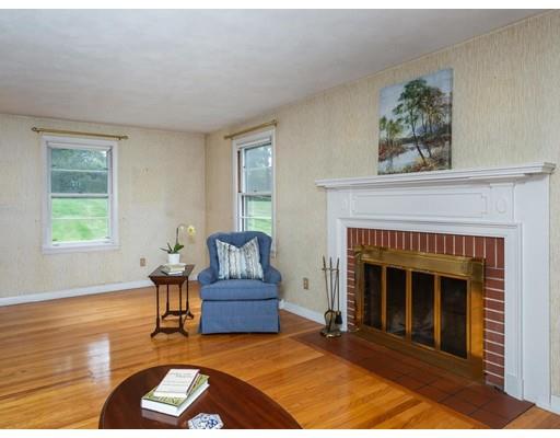 67 Newton Road Springfield, MA 01118 - Photo 9 of 41 a living room with furniture and a fireplace