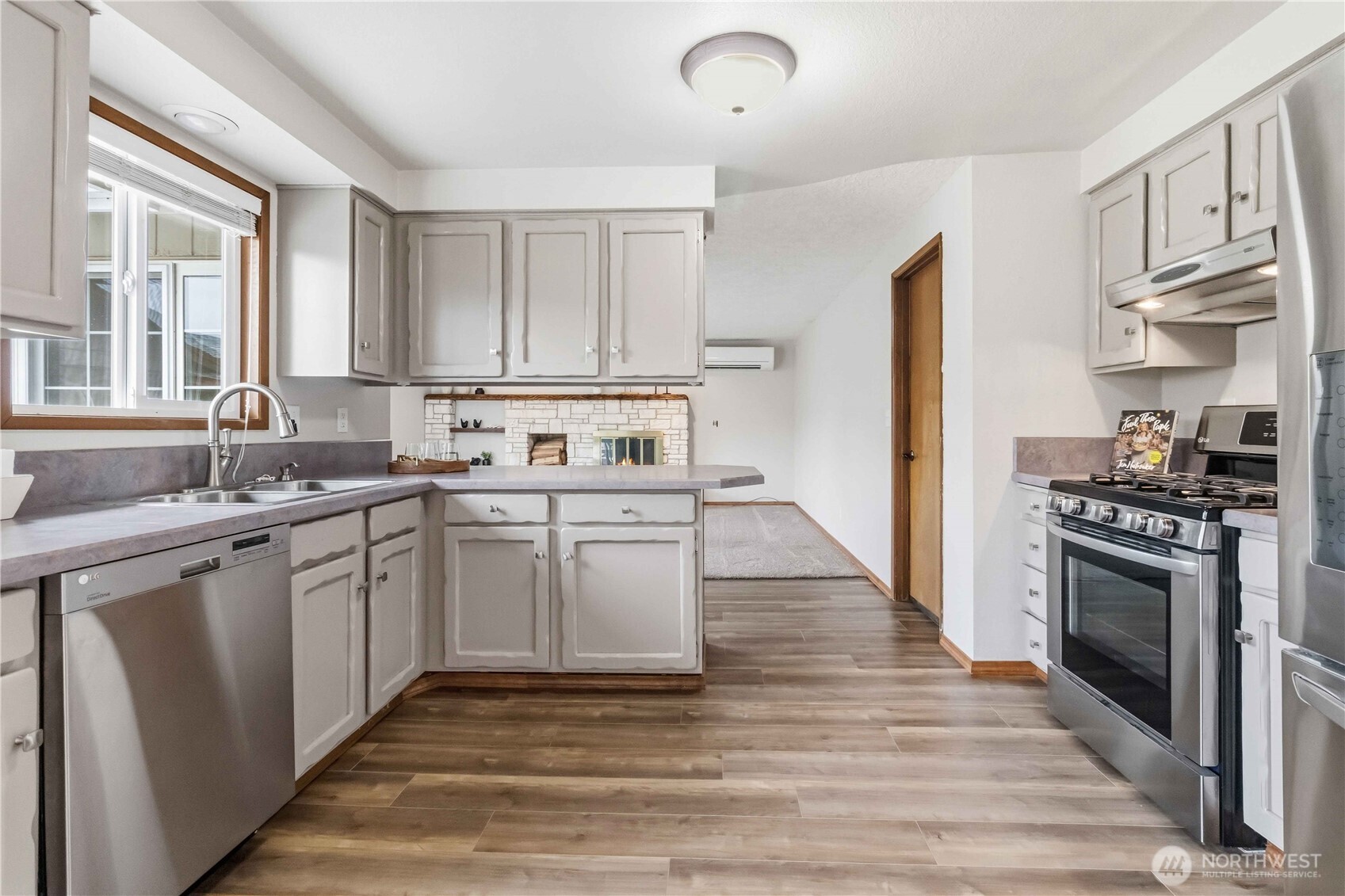 1 Independence Court Longview, WA 98632 - Photo 11 of 30 a kitchen with stainless steel appliances granite countertop a stove a sink and a refrigerator