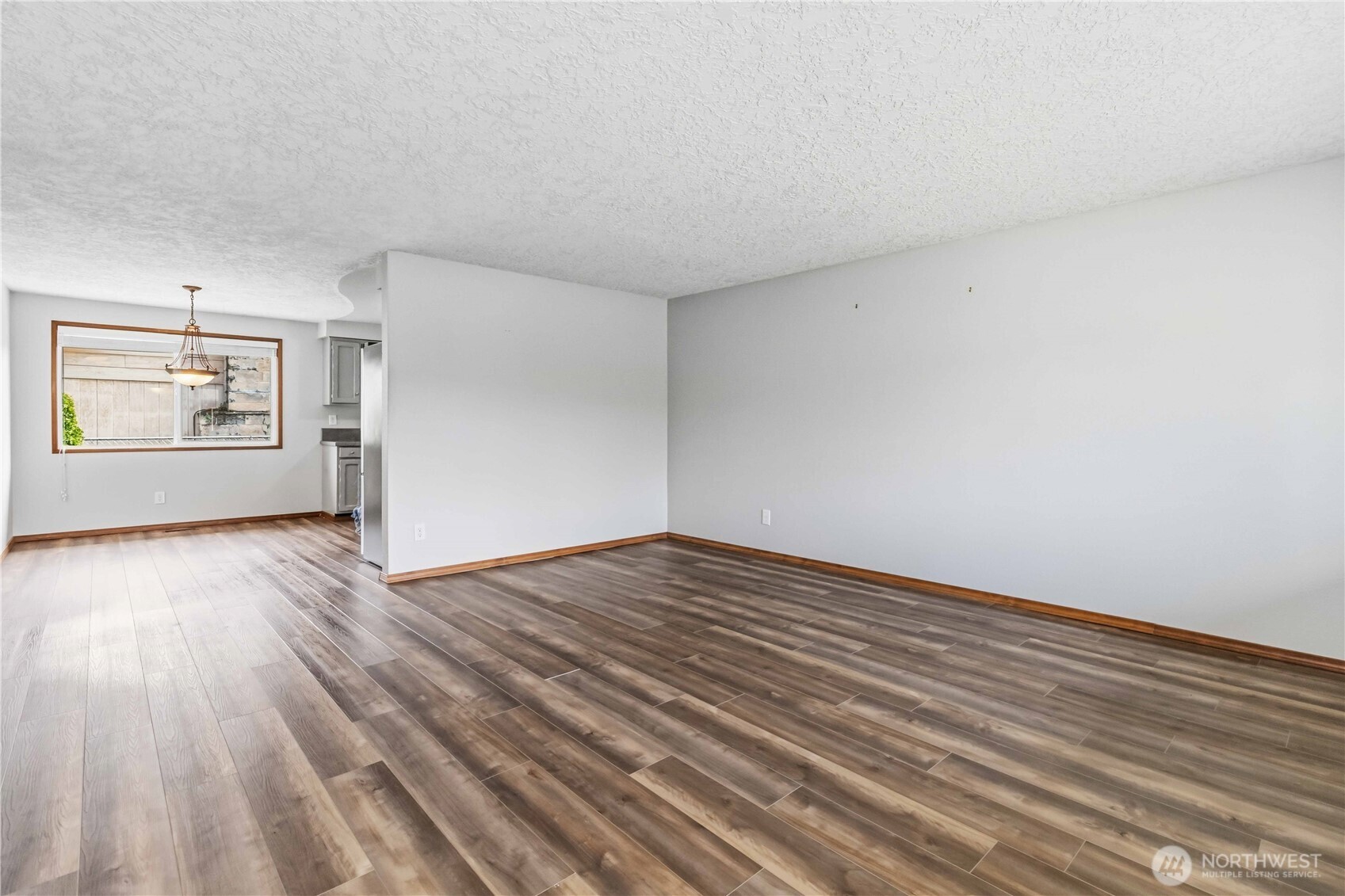 1 Independence Court Longview, WA 98632 - Photo 3 of 30 an empty room with wooden floor and windows