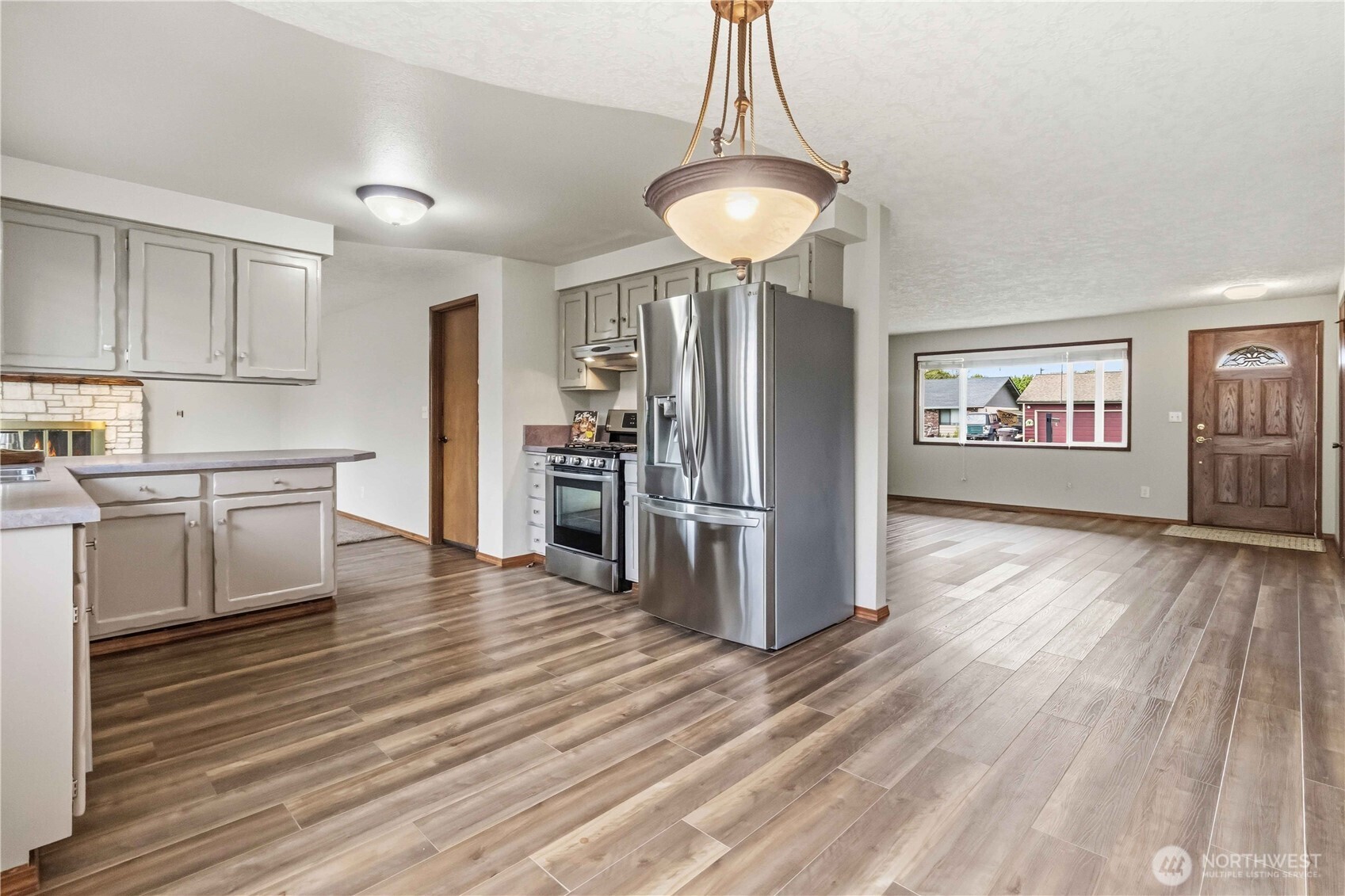 1 Independence Court Longview, WA 98632 - Photo 6 of 30 a kitchen with stainless steel appliances a refrigerator and a stove top oven