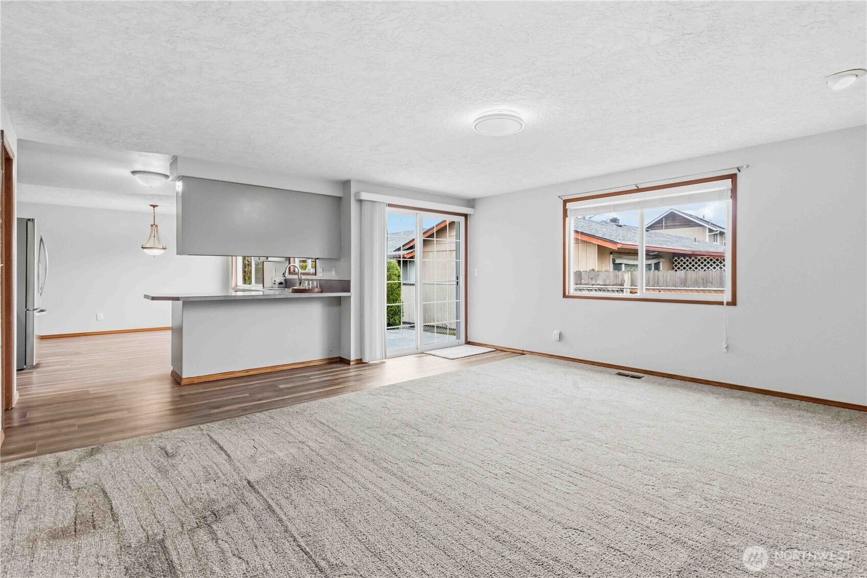 1 Independence Court Longview, WA 98632 - Photo 10 of 30 a view of a big room with wooden floor and a kitchen