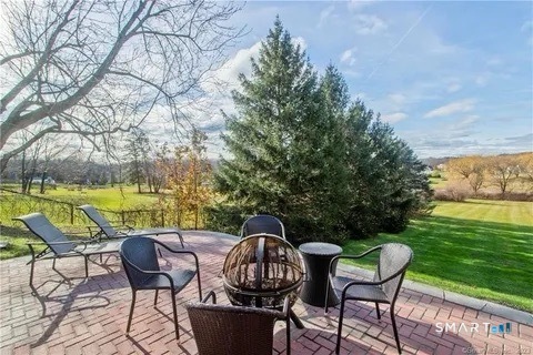 7 Riverview Street Enfield, CT 06082 - Photo 11 of 29 a view of a chairs and table in the patio