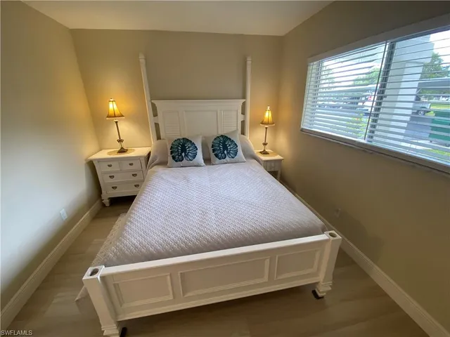 a kitchen with stainless steel appliances kitchen island granite countertop a stove a sink a refrigerator and a microwave