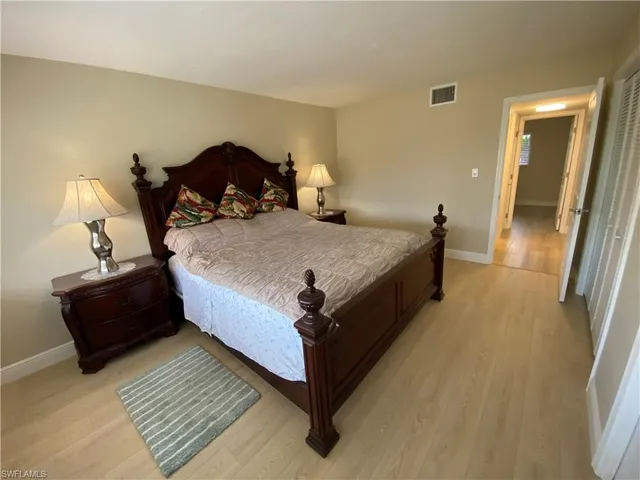 a bathroom with a granite countertop sink a mirror and shower