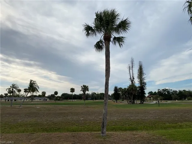 a swimming pool with outdoor seating