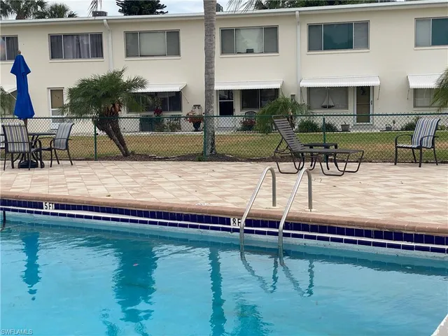 a view of a swimming pool with a lounge chairs