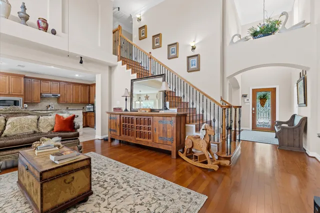 a living room with lots of furniture and a rug