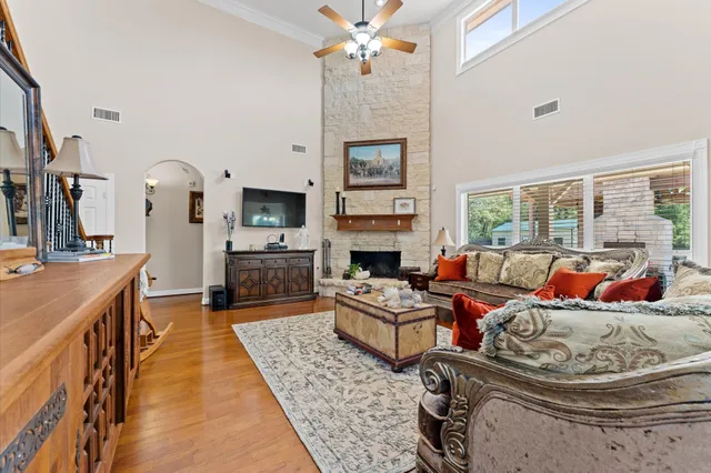 a living room with furniture and a fireplace