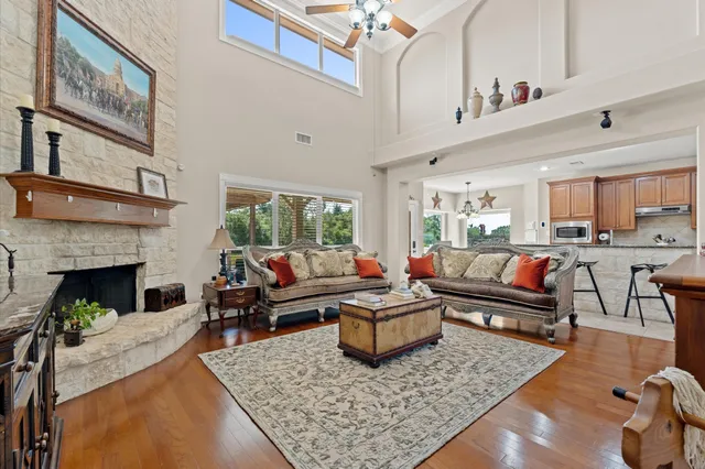 a living room with furniture and a fireplace