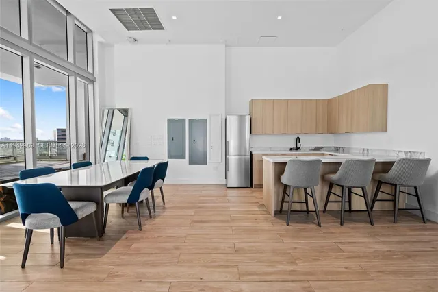a kitchen with a table and chairs in it