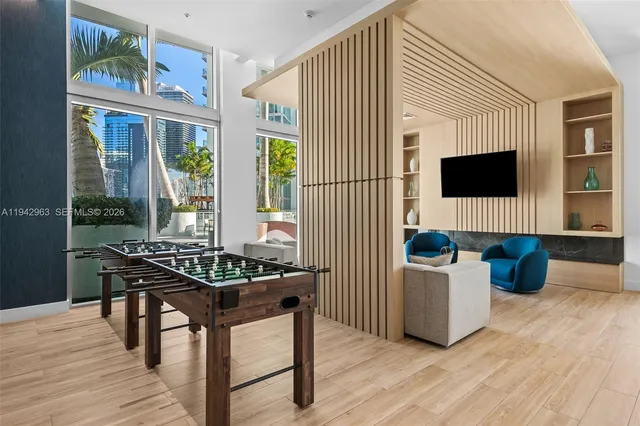 a dining room with furniture and wooden floor