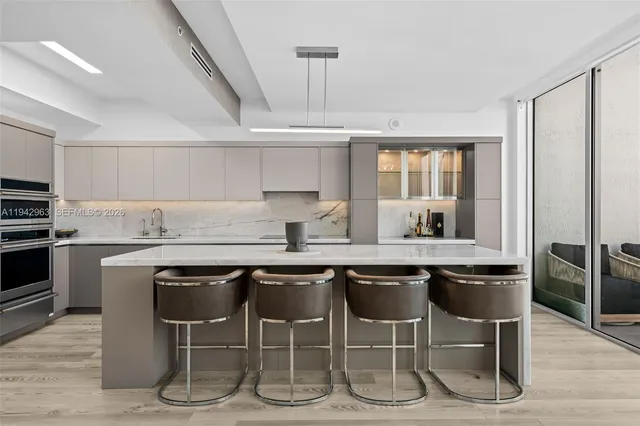 a kitchen with stainless steel appliances granite countertop a stove and a refrigerator