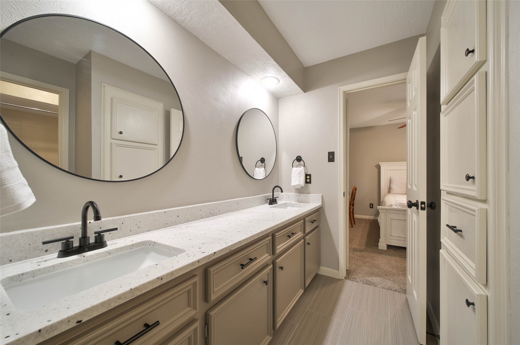 17007 Windrow Drive Spring, TX 77379 - Photo 32 of 46 a spacious bathroom with a double vanity sink and a mirror