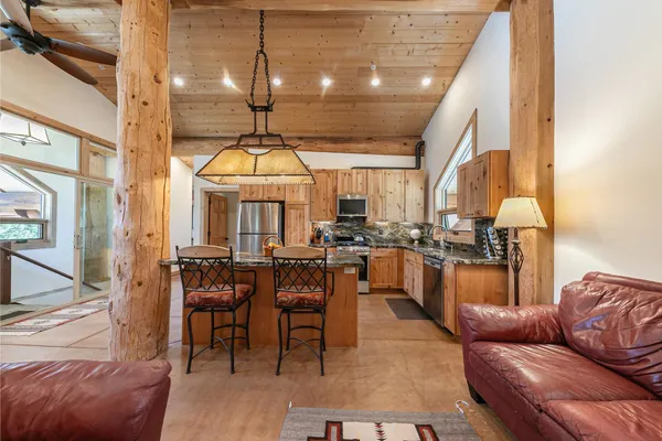a dining room with furniture and a window