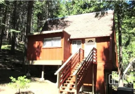 a view of building with a tree in the background