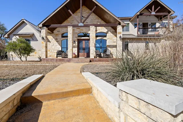a large kitchen with a table and chairs
