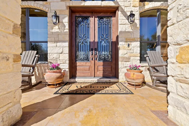 a kitchen with stainless steel appliances granite countertop a sink a stove and a wooden floors