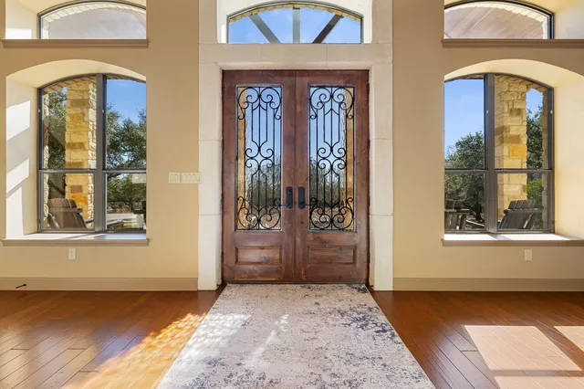 a large kitchen with stainless steel appliances lots of counter space and a sink