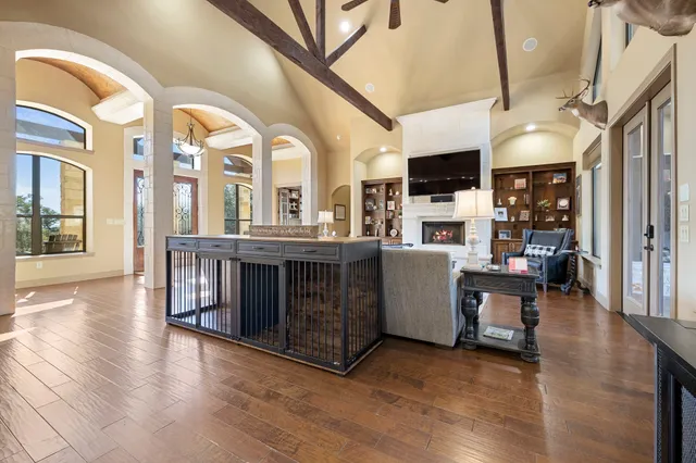 a large kitchen with kitchen island a stove a sink a center island and stainless steel appliances