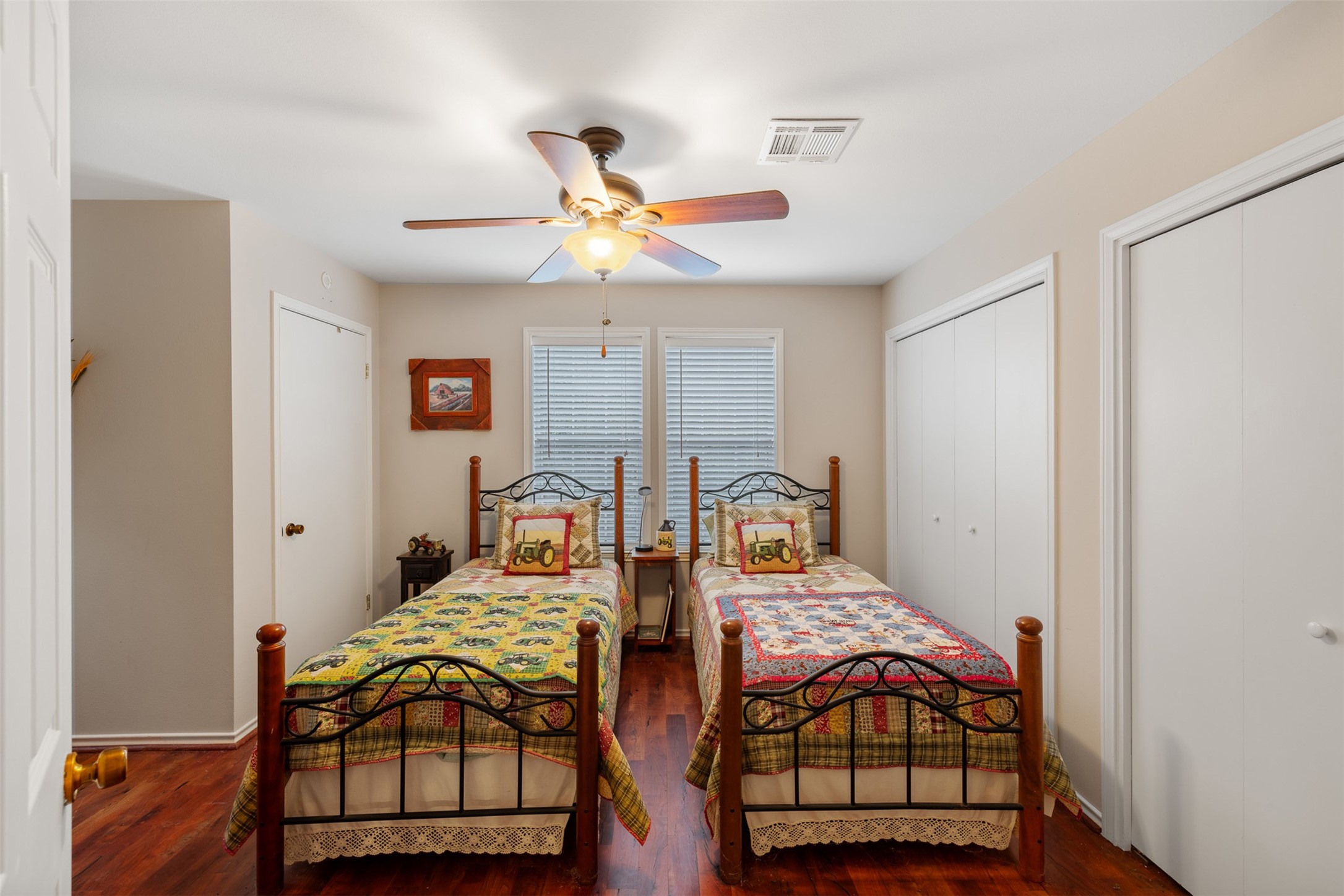 1131 Greak Road Weimar, TX 78962 - Photo 16 of 42 a bedroom with two beds and painting on the wall