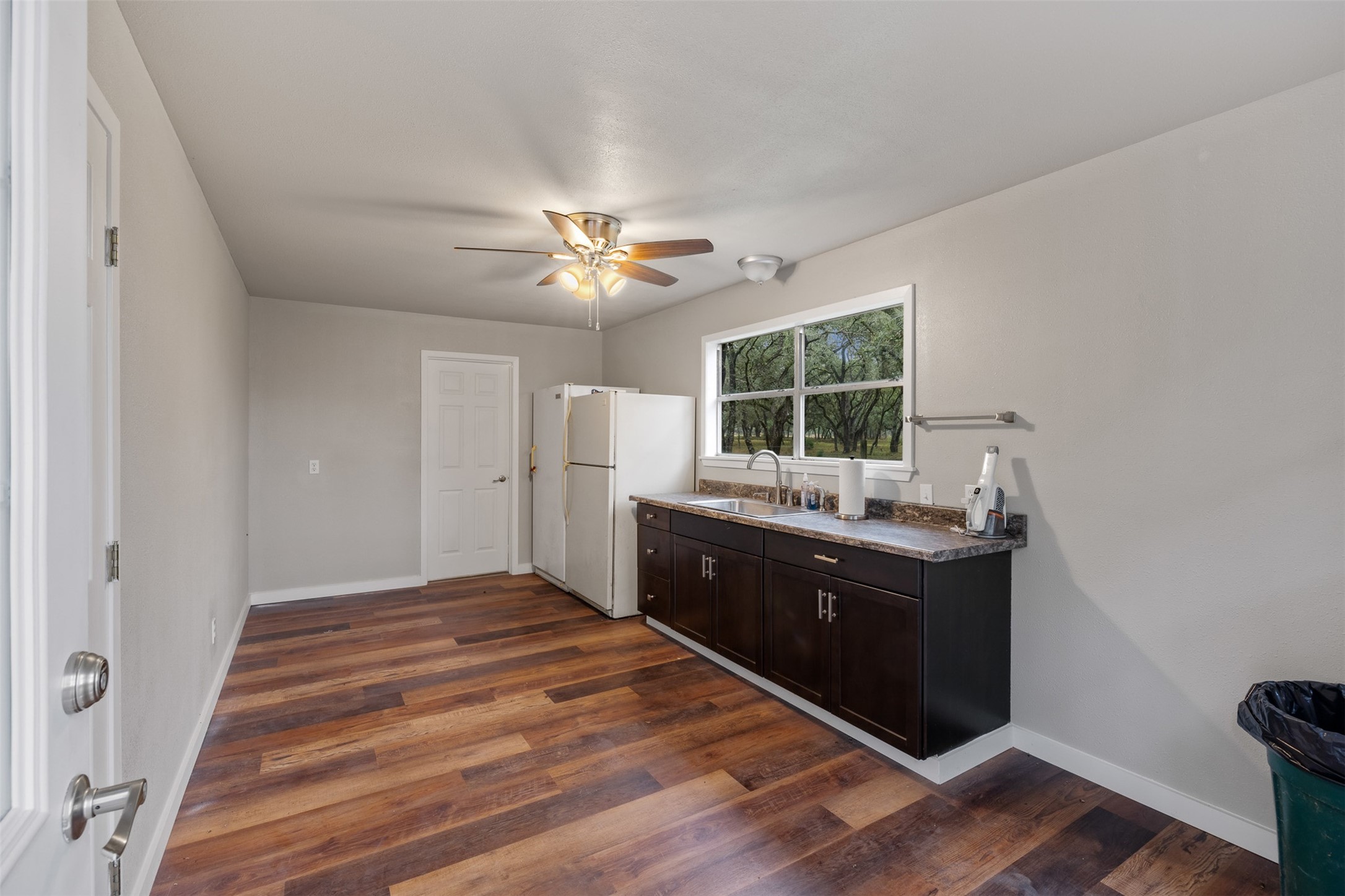 1131 Greak Road Weimar, TX 78962 - Photo 22 of 42 a bedroom with a bed and a chandelier