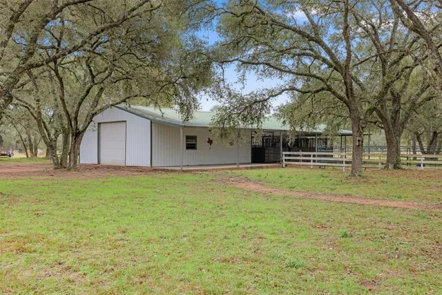a house with trees in front of it