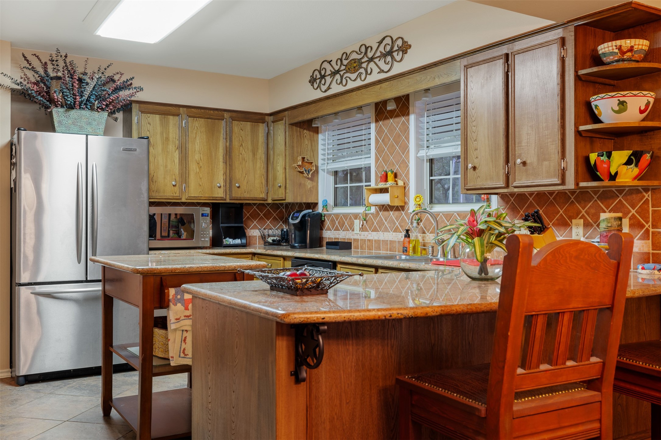 1131 Greak Road Weimar, TX 78962 - Photo 8 of 42 a kitchen with stainless steel appliances granite countertop a stove a refrigerator and a dining table