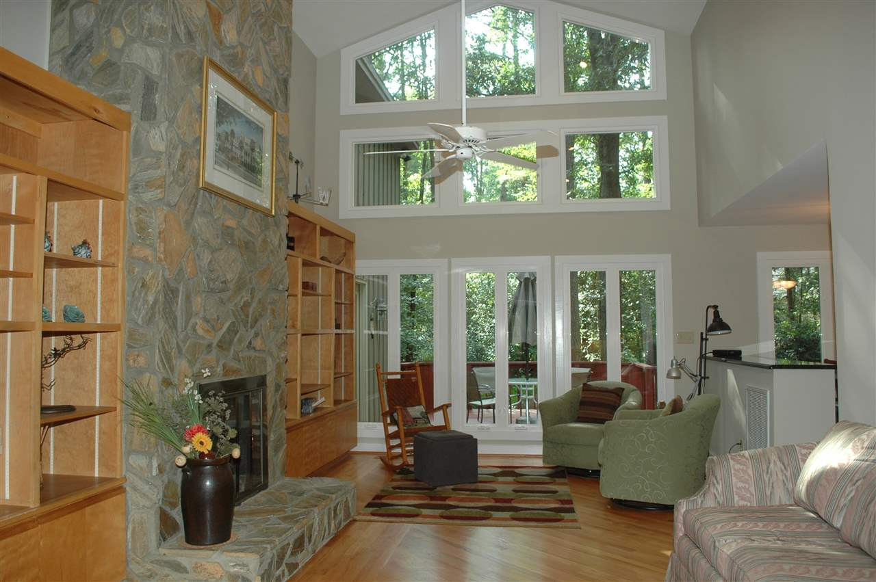 2012 Countrywood Road North Raleigh, NC 27615 - Photo 2 of 18 Light & bright spacious family room with cathedral ceiling & lots of windows to enjoy the large deck and lovely backyard. Hardwood floors and custom stone fireplace with built-in bookshelves. Family room opens to breakfast rm and kitchen. Family Room