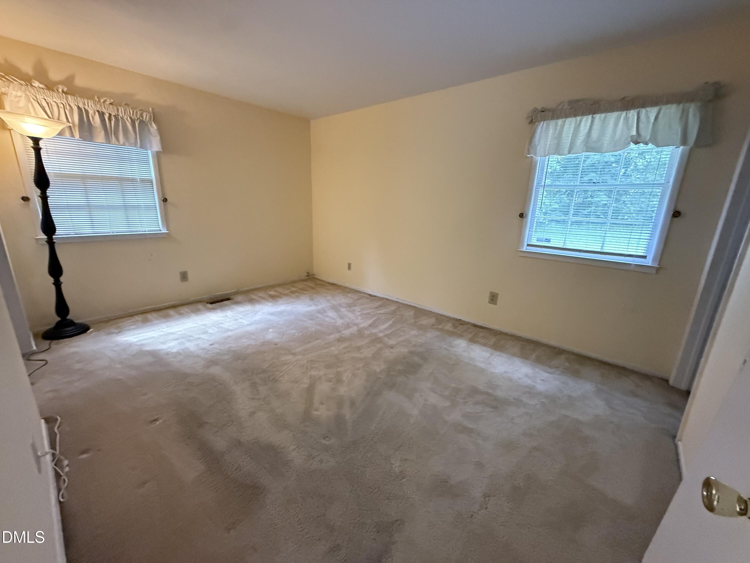 1010 Wyldewood Road Durham, NC 27704 - Photo 13 of 26 a view of an empty room with a window