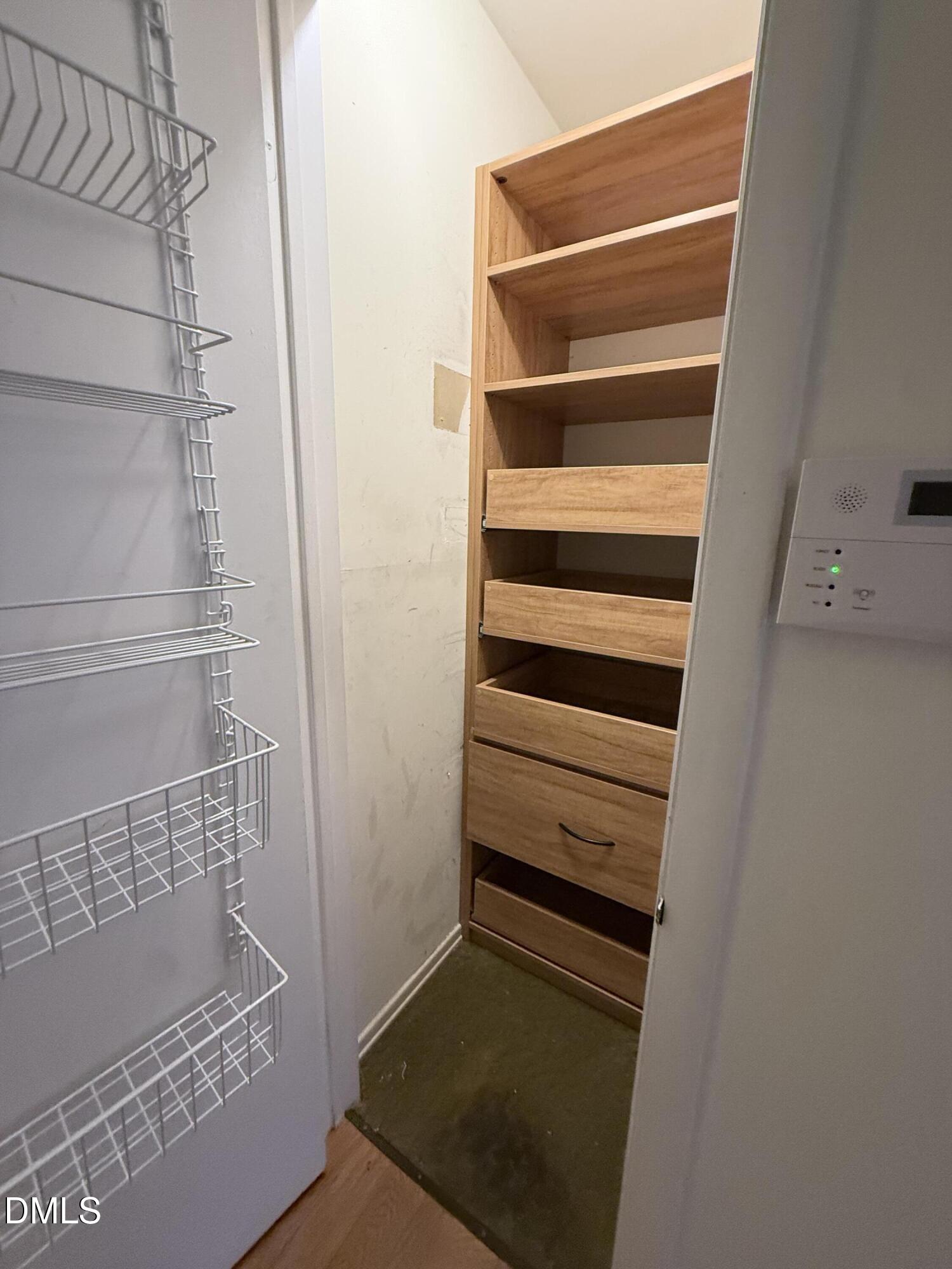1010 Wyldewood Road Durham, NC 27704 - Photo 15 of 26 a view of walk in closet with empty racks