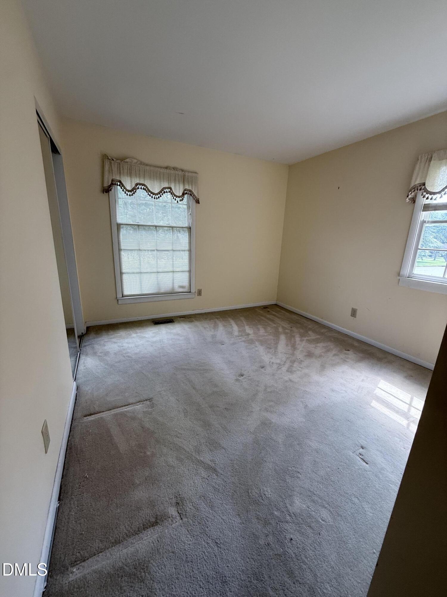 1010 Wyldewood Road Durham, NC 27704 - Photo 18 of 26 a view of an empty room with a window