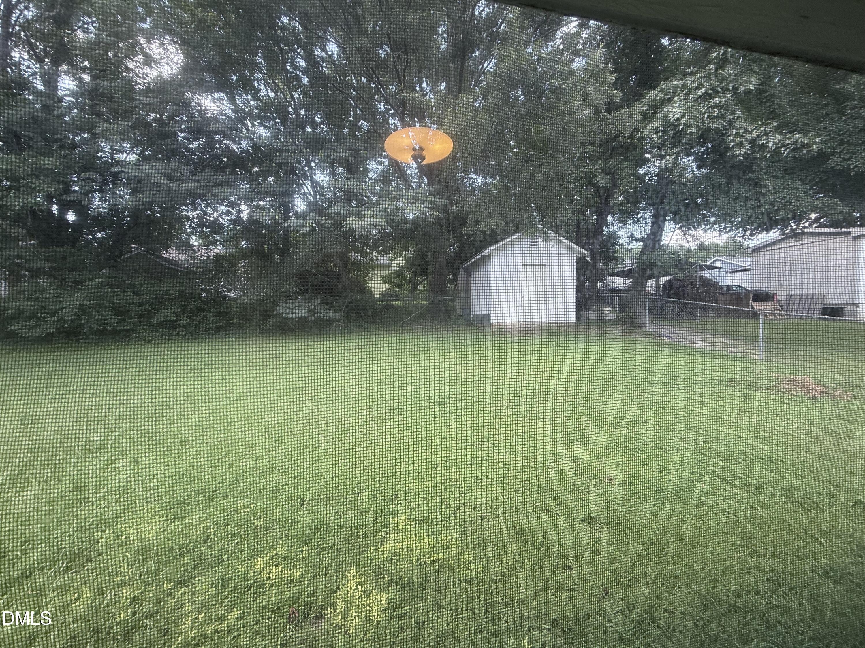 1010 Wyldewood Road Durham, NC 27704 - Photo 23 of 26 a backyard of a house with table and chairs