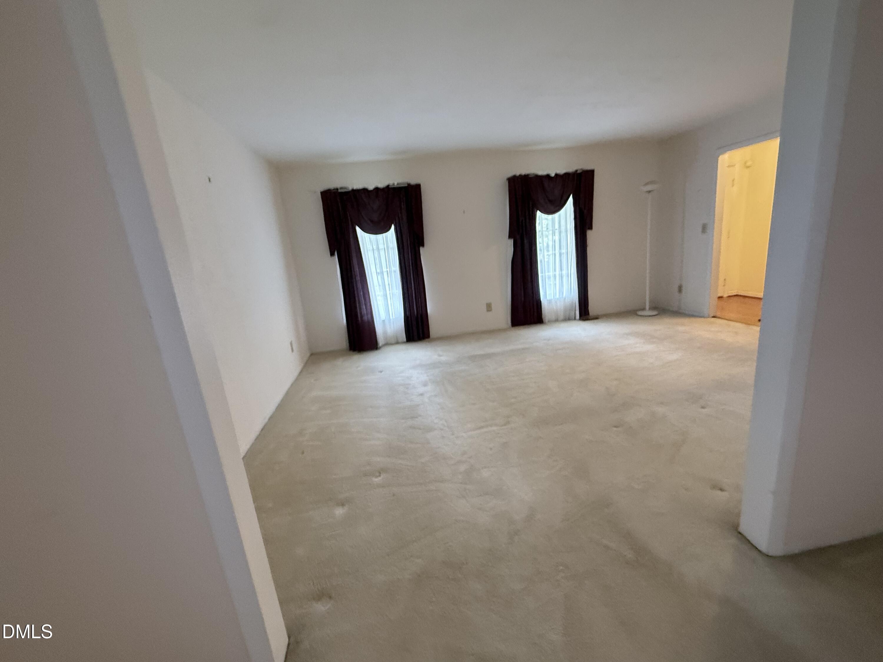 1010 Wyldewood Road Durham, NC 27704 - Photo 5 of 26 a view of an empty room with window and closet area