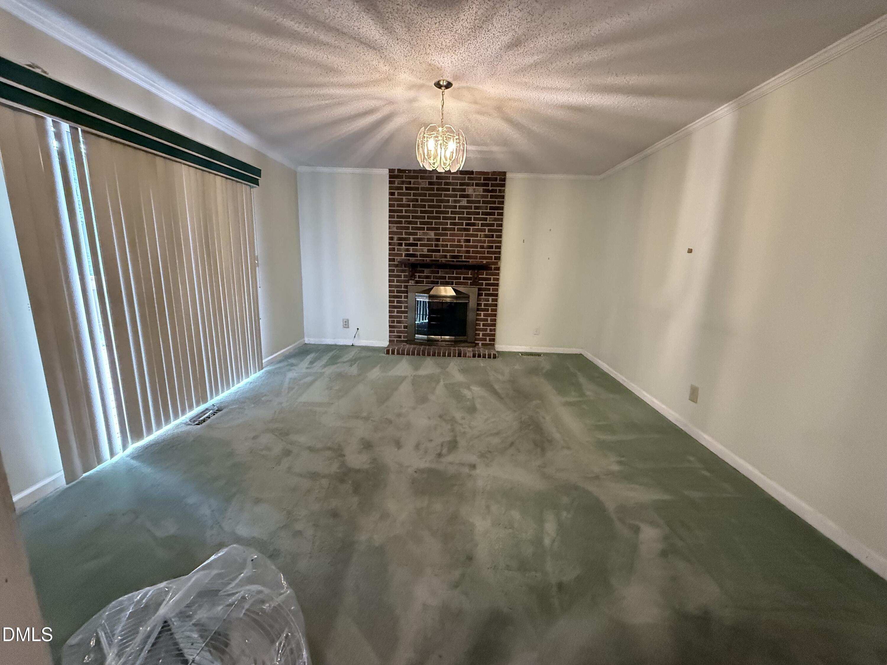 1010 Wyldewood Road Durham, NC 27704 - Photo 8 of 26 a view of an empty room with a window