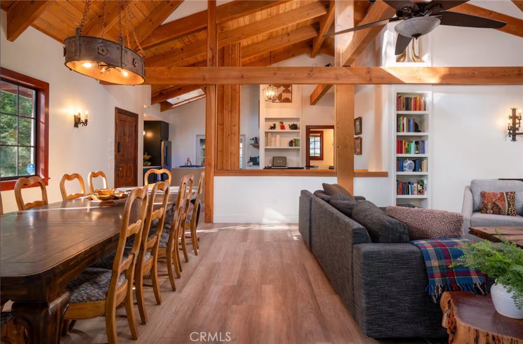 764 Fern Road Lake Arrowhead, CA 92385 - Photo 17 of 60 a living room with furniture a wooden floor and a chandelier