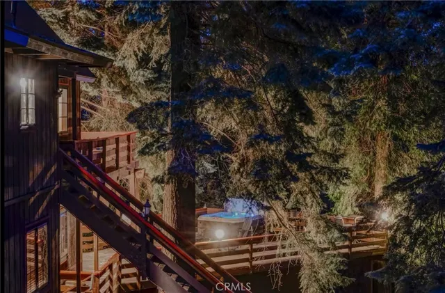 a view of a patio with table and chairs and wooden floor