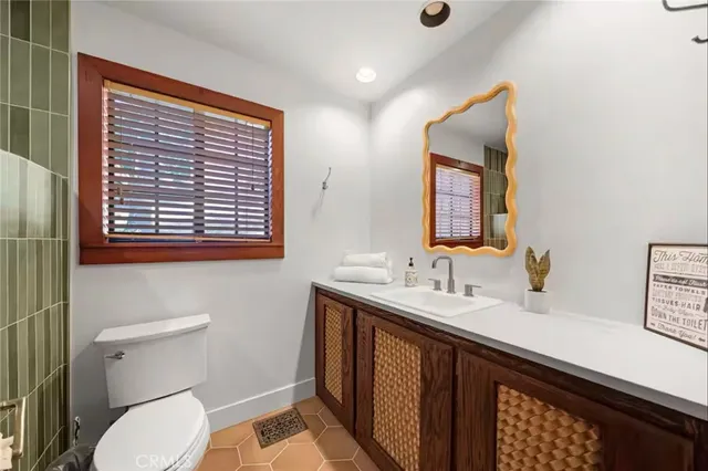 a view of backyard with seating space and trees