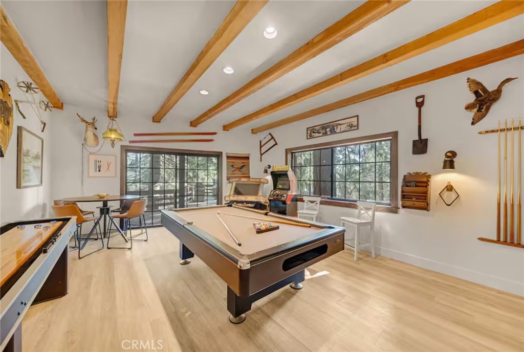 764 Fern Road Lake Arrowhead, CA 92385 - Photo 32 of 60 a living room with pool table and wooden floor