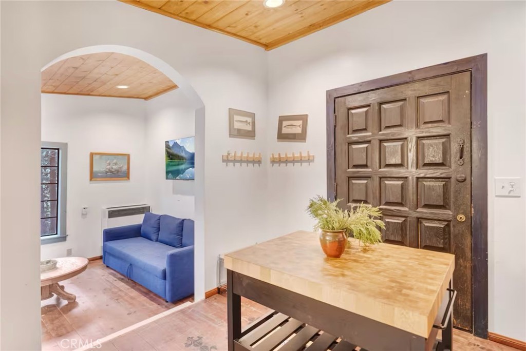 764 Fern Road Lake Arrowhead, CA 92385 - Photo 52 of 60 a view of a dining room with furniture and wooden floor