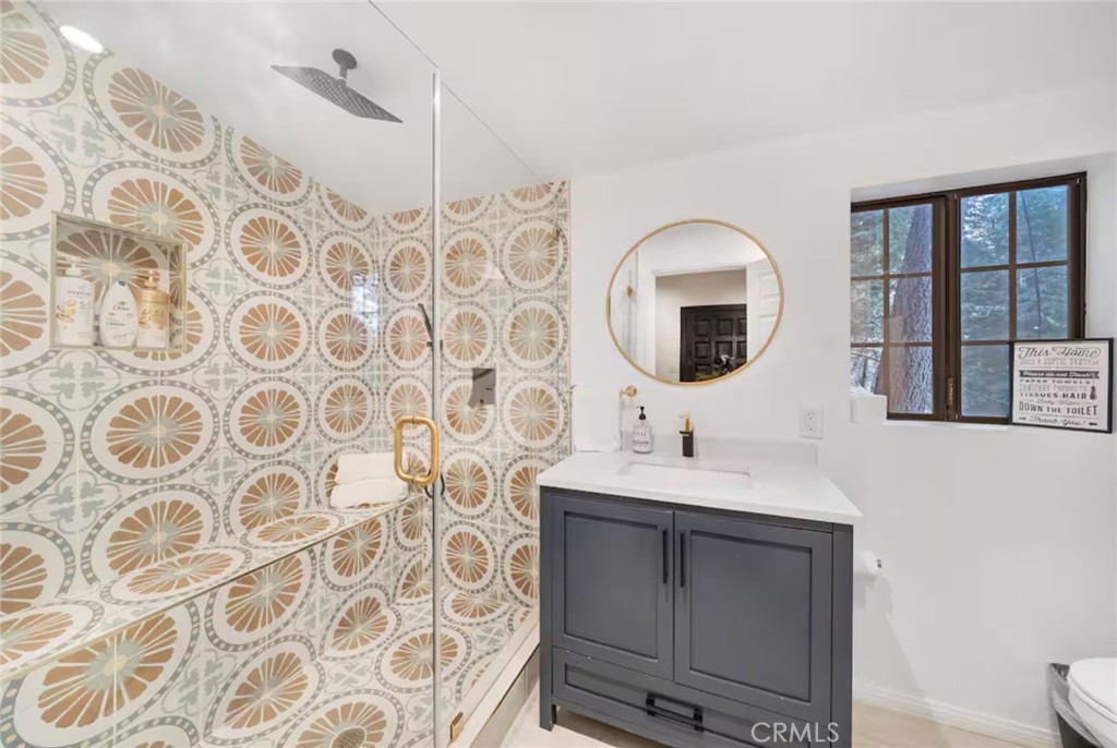 764 Fern Road Lake Arrowhead, CA 92385 - Photo 57 of 60 a bathroom with a sink and a mirror