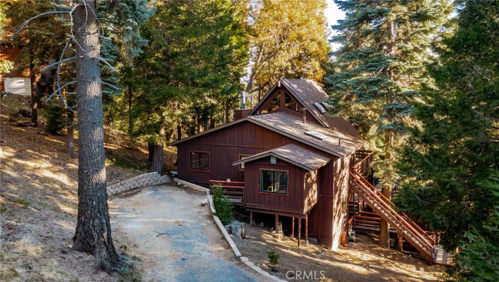 764 Fern Road Lake Arrowhead, CA 92385 - Photo 60 of 60 a view of a house with a small yard and a large tree