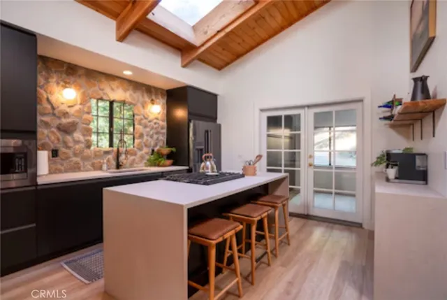 a kitchen that has a sink and a stove