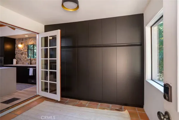 a kitchen with a sink appliances and cabinets